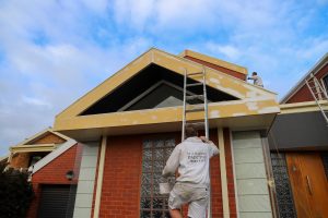 Our painter climbing new heights to prep a house